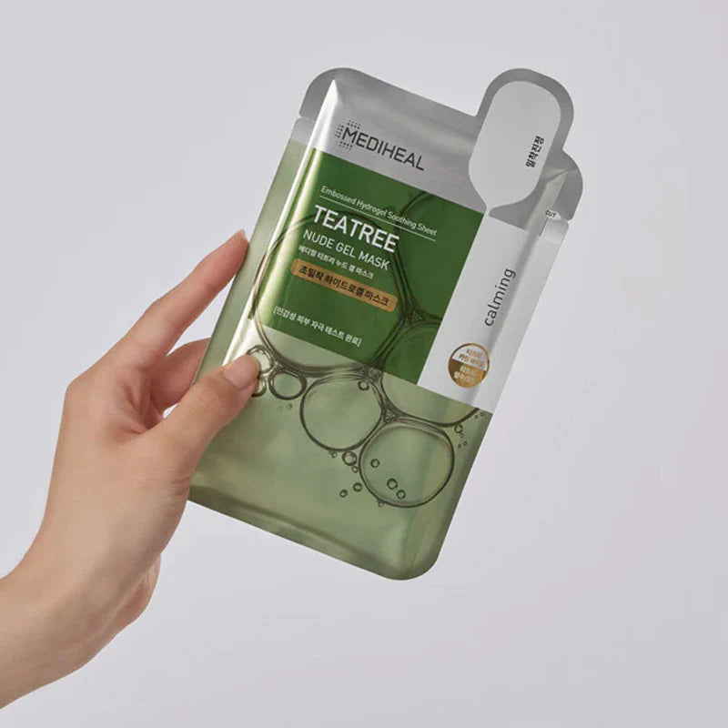 MEDIHEAL Teatree Nude Gel Mask held by a hand on a gray background