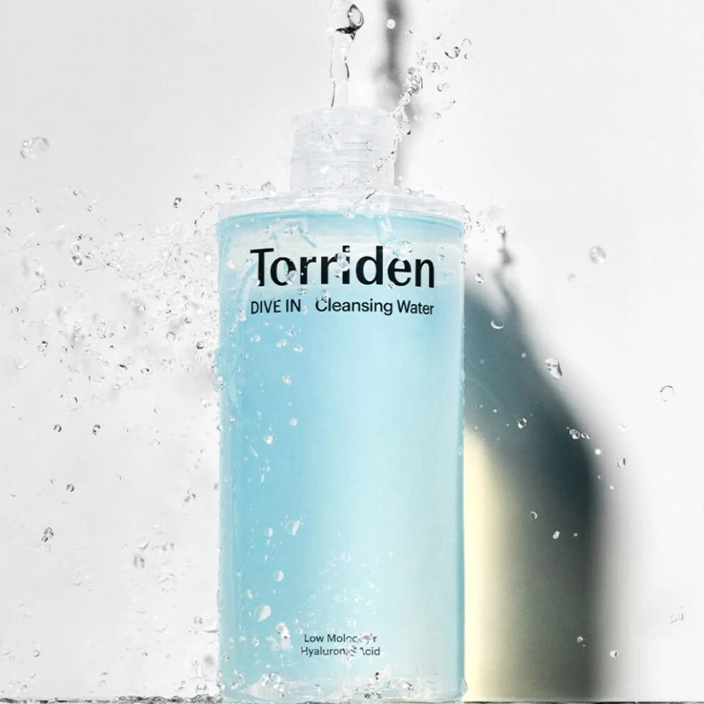 Torriden cleansing water bottle with water droplets on a light background