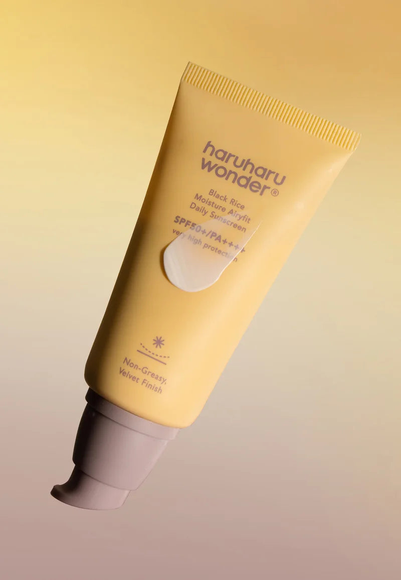 Tube of Haruharu Wonder skincare product on a gradient yellow and beige background