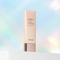 Artless Glow Tinted Sunscreen bottle on a gradient background