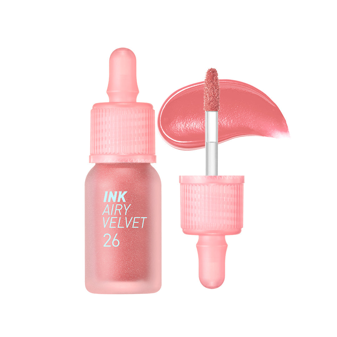 A bottle of Peripera Ink Airy Velvet Lip Tint with a dropper applicator, alongside a swatch of the peachy pink color on a white background.