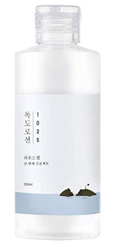A bottle of Round Lab Dokdo Lotion 200ml with a label featuring Ulleungdo Island imagery.