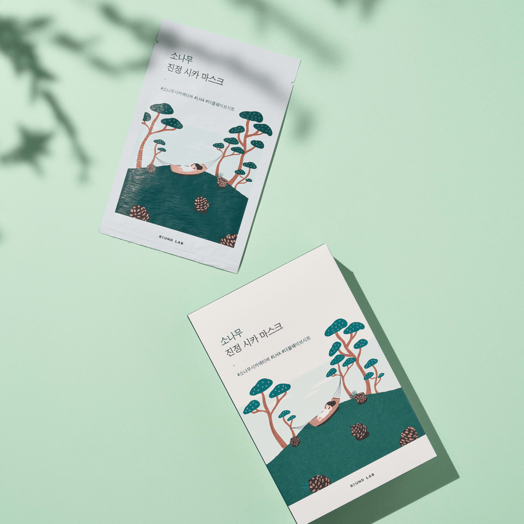 Packaging of Round Lab Pine Calming Cica Sheet Mask with a green and white color scheme, displaying the product name and description.